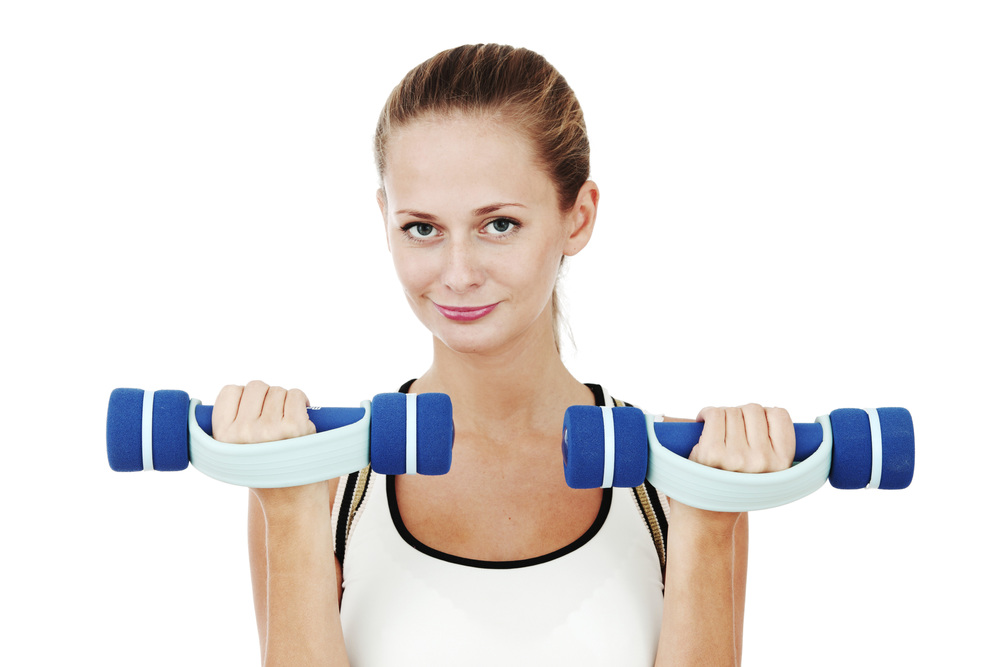 dumbbells in woman hands isolated on white background. dumbbells in woman hands