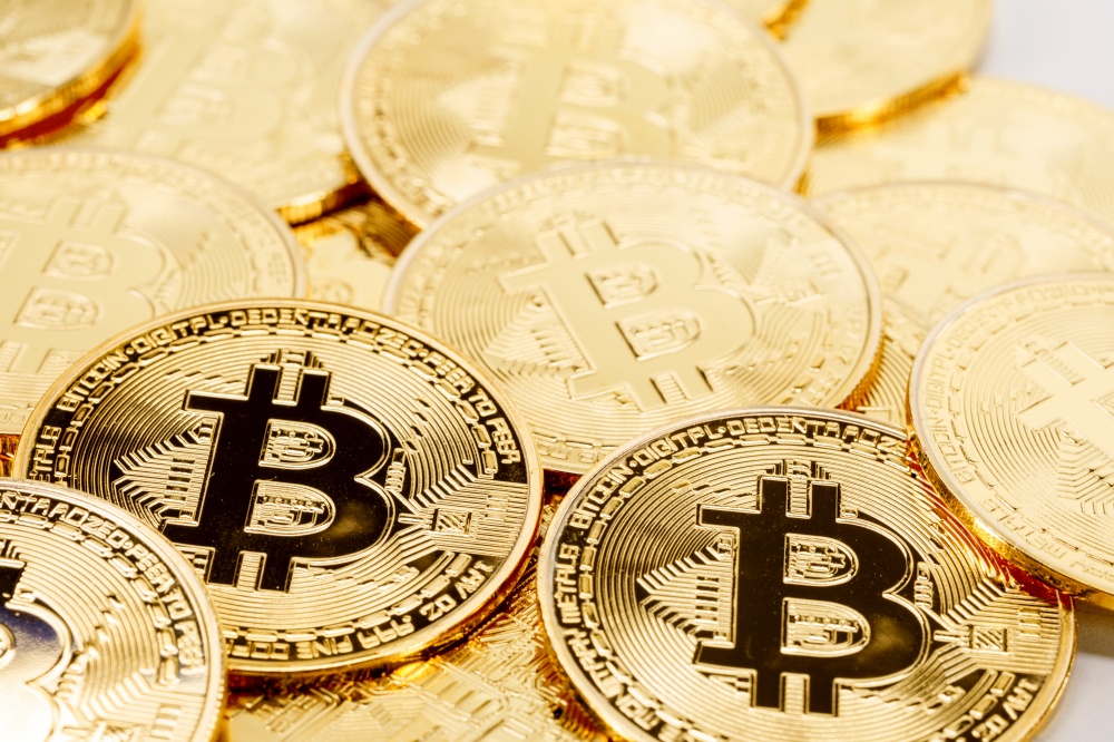 Background of gold coins with bitcoin sign. Background of bitcoins