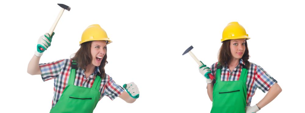The young woman with hammer on white. Young woman with hammer on white