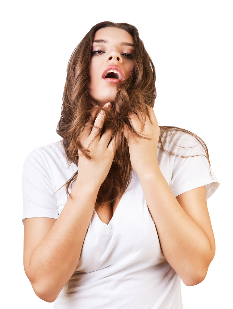sexy woman touching her hair on white background