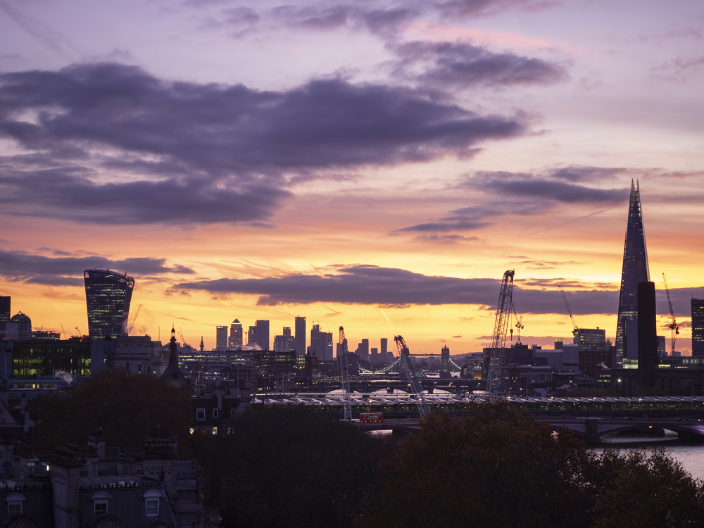 Majestic dawn sunrise landscape cityscape over London city sykline looking East along River Thames