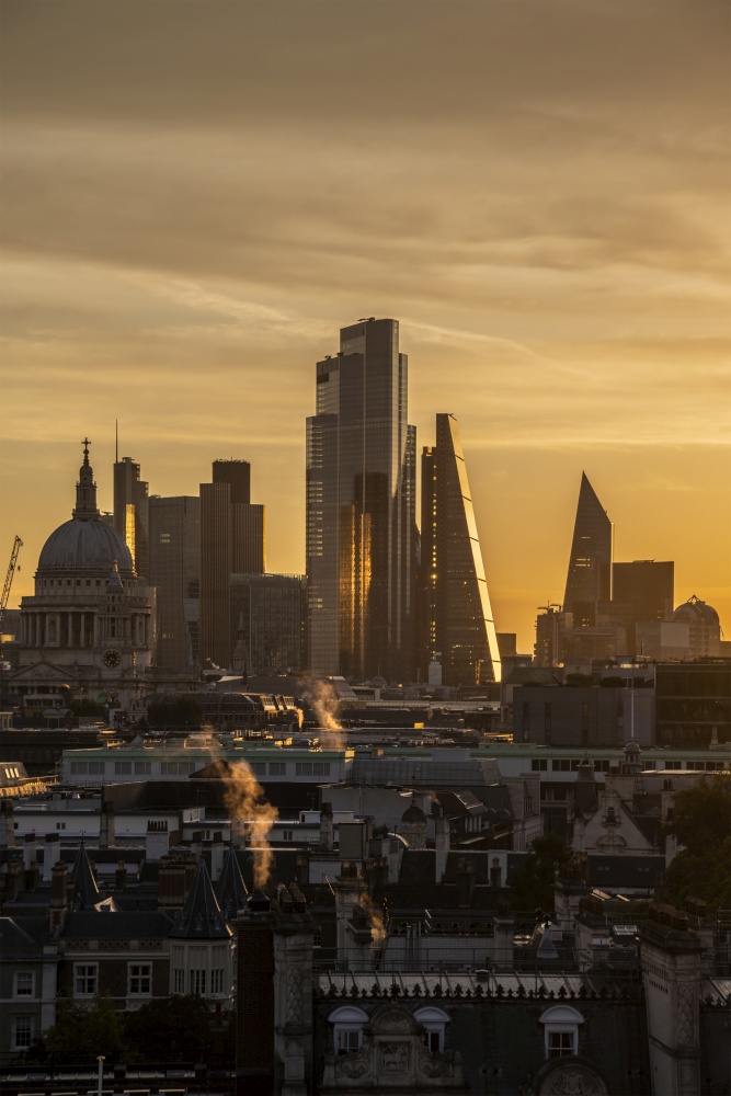 Epic landscape cityscape skyline image of London in England during colorful Autumn Fall sunrise