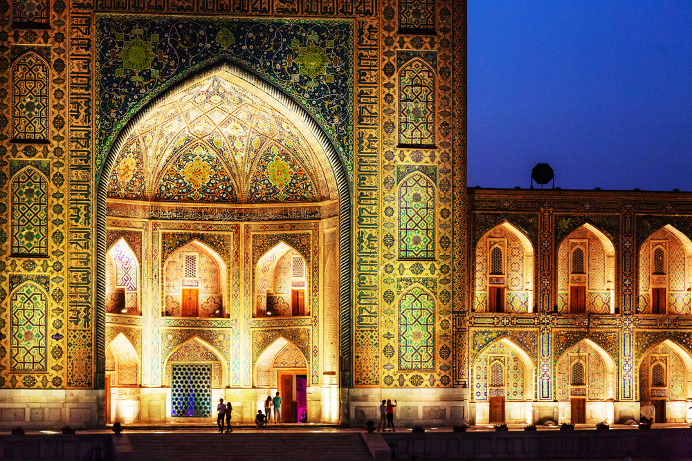 Registan Square in Samarkand. Madrasah at night with light