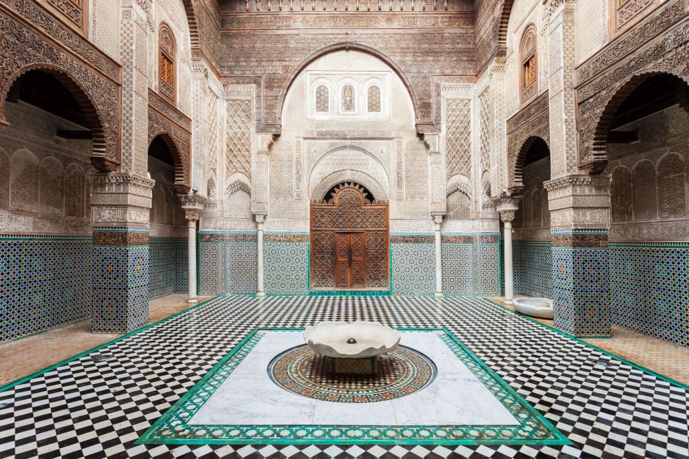 FES, MOROCCO - FEBRUARY 27, 2016: The Al-Attarine Madrasa is a madrasa in Fez medina in Morocco, near the Al-Qarawiyyin Fez Mosque