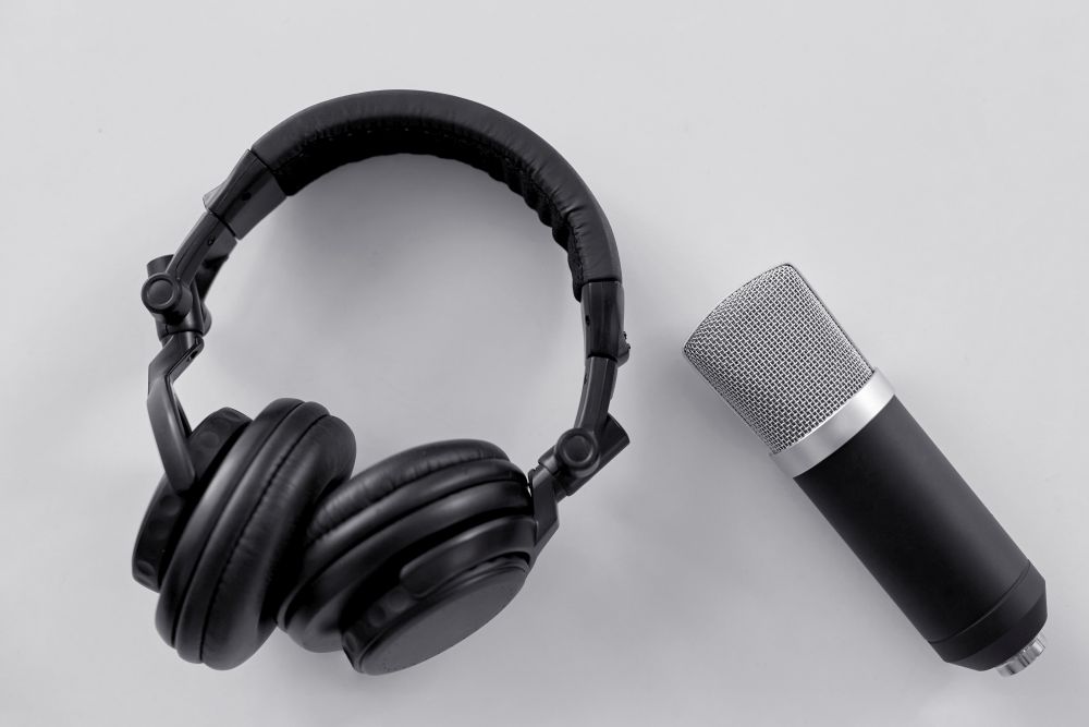 technology, sound recording and audio equipment concept - headphones and microphone on white background. headphones and microphone on white background