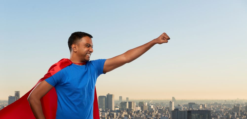 super power and people concept - indian man in red superhero cape making winning gesture over tokyo city background. indian man in superhero cape makes winning gesture
