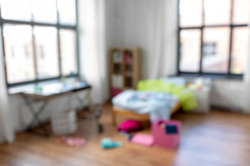 mess, disorder and interior concept - blurred view of messy home kid&rsquo;s room with scattered stuff. blurred view of messy home or kid&rsquo;s room