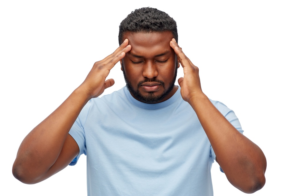 people, grooming and beauty concept - stressed young african american man having headache over white background. stressed young african american man with headache