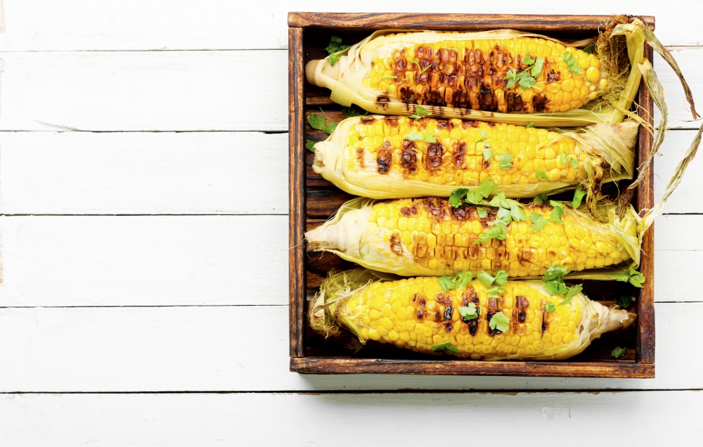 Tasty grilled corn cobs.Delicious grilled mexican corn. Grilled sweet corn cob