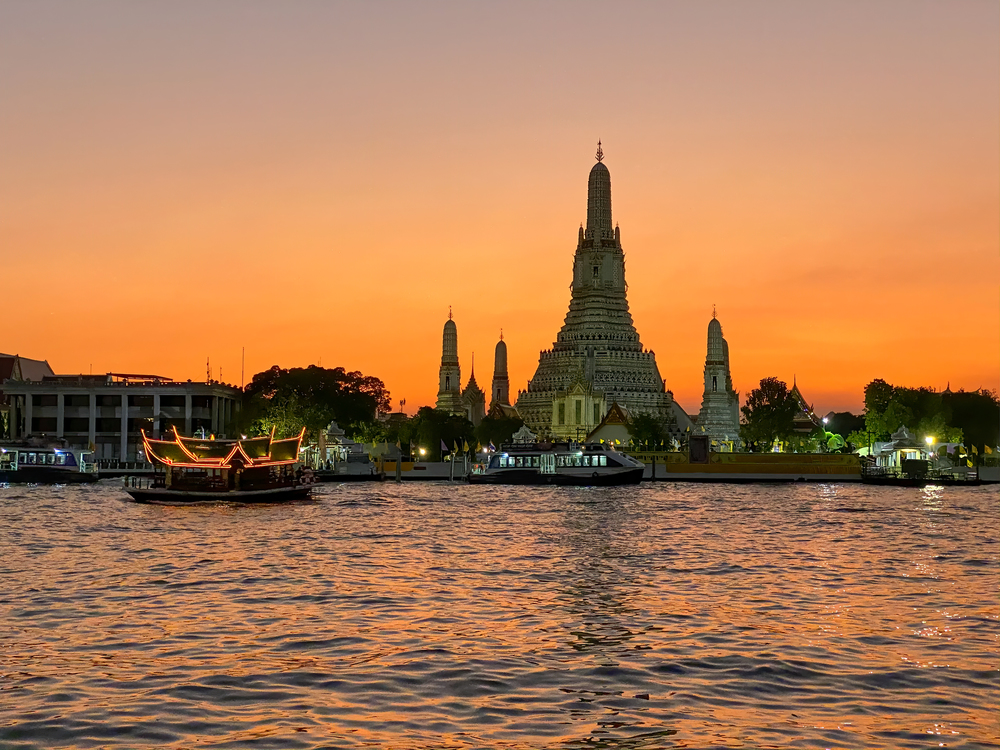 Wat Arun and Chao Phraya at sunset, Bangkok.