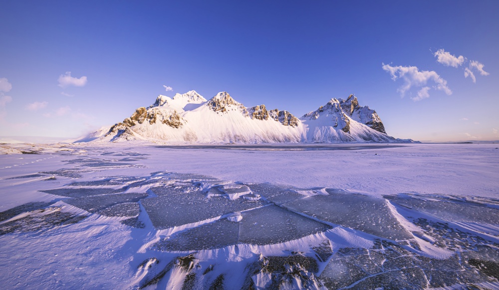 Vestrahorn Mountains on Stokksnes cape with ice floes in front, beautiful winter morning scenery, Iceland