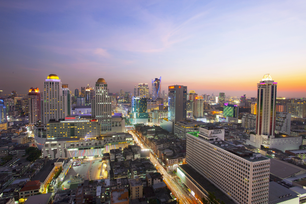 BANGKOK THAILAND - APRIL21 : beautiful sunset sky and building lighting at ratchaprarop road  in heart of bangkok business center  on april 21 , 2015 in bangkok thailand