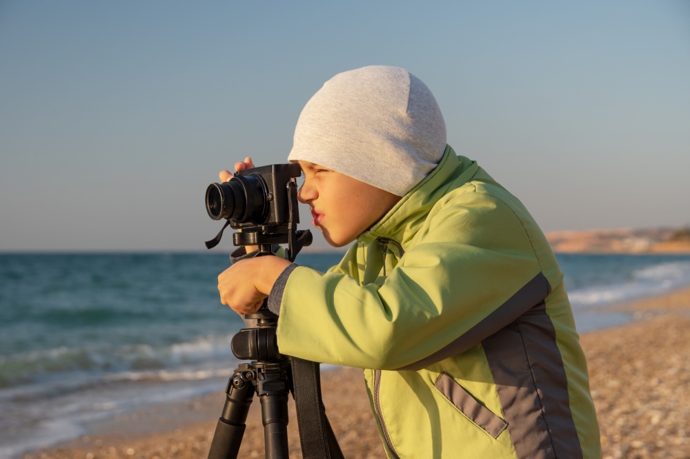 A young boy tries to learn and take photos.