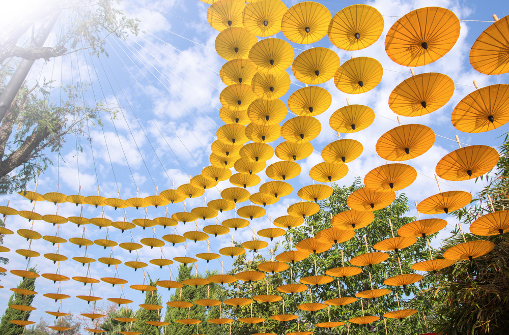many decoration with hanging yellow umbrella outdoor
