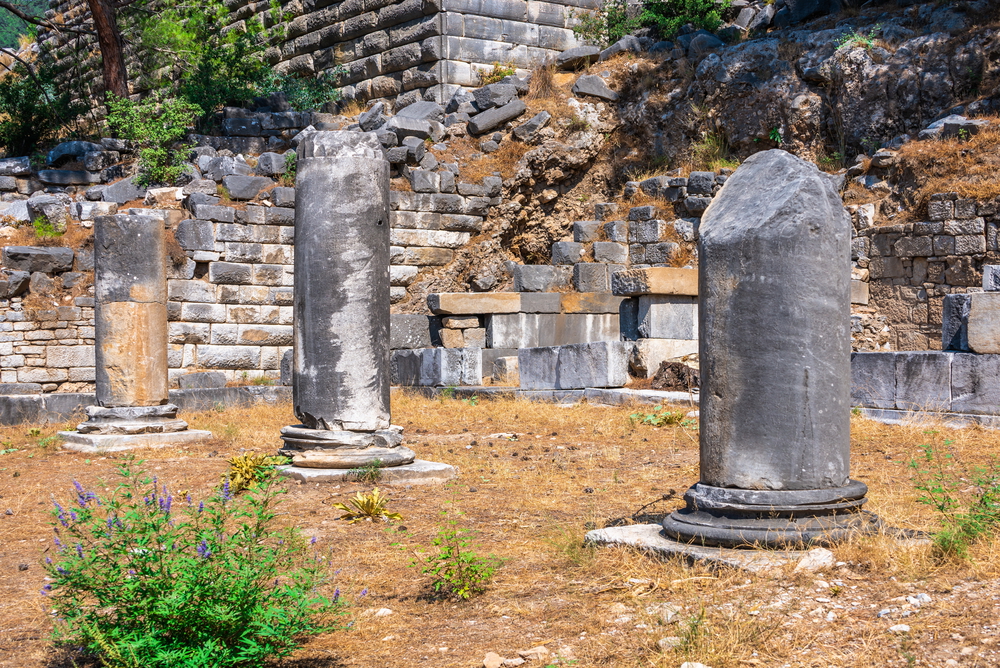 Ruins of the Ancient Theatre in the greek city of Priene in Turkey on a sunny summer day. Ancient Greek city Priene on the western coast of Turkey