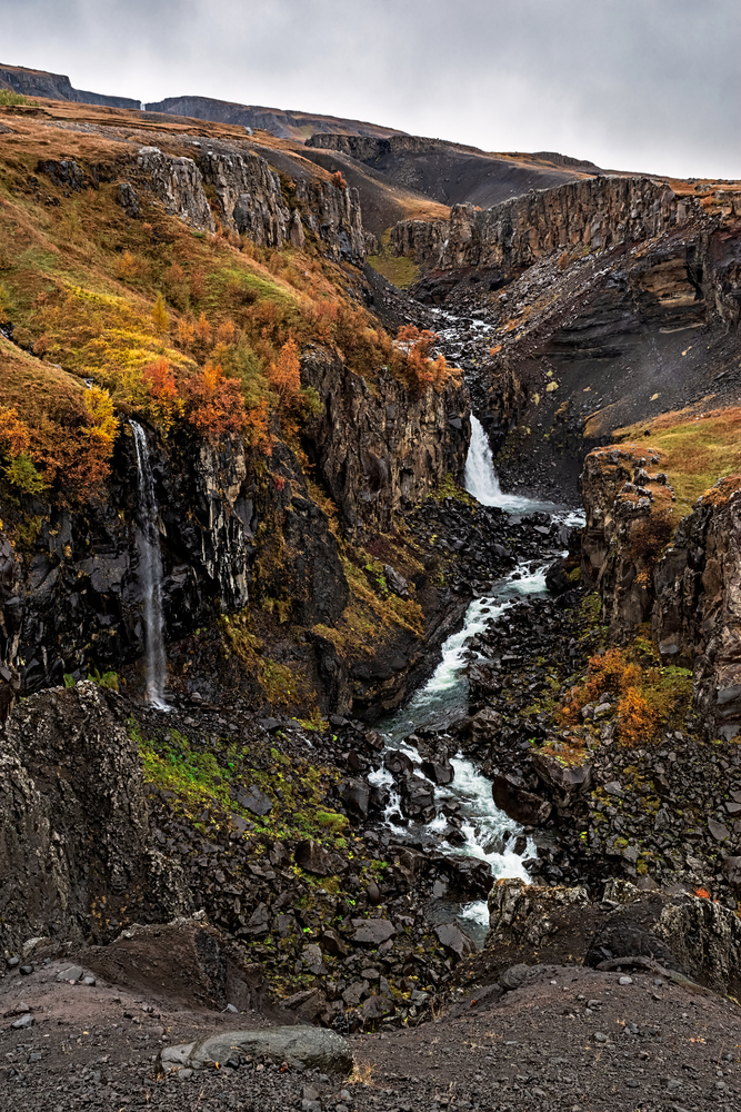 Hengifoss and litlanesfoss waterfalls in eastside of Iceland in a cloudy day. Hengifoss and litlanesfoss waterfalls, Iceland