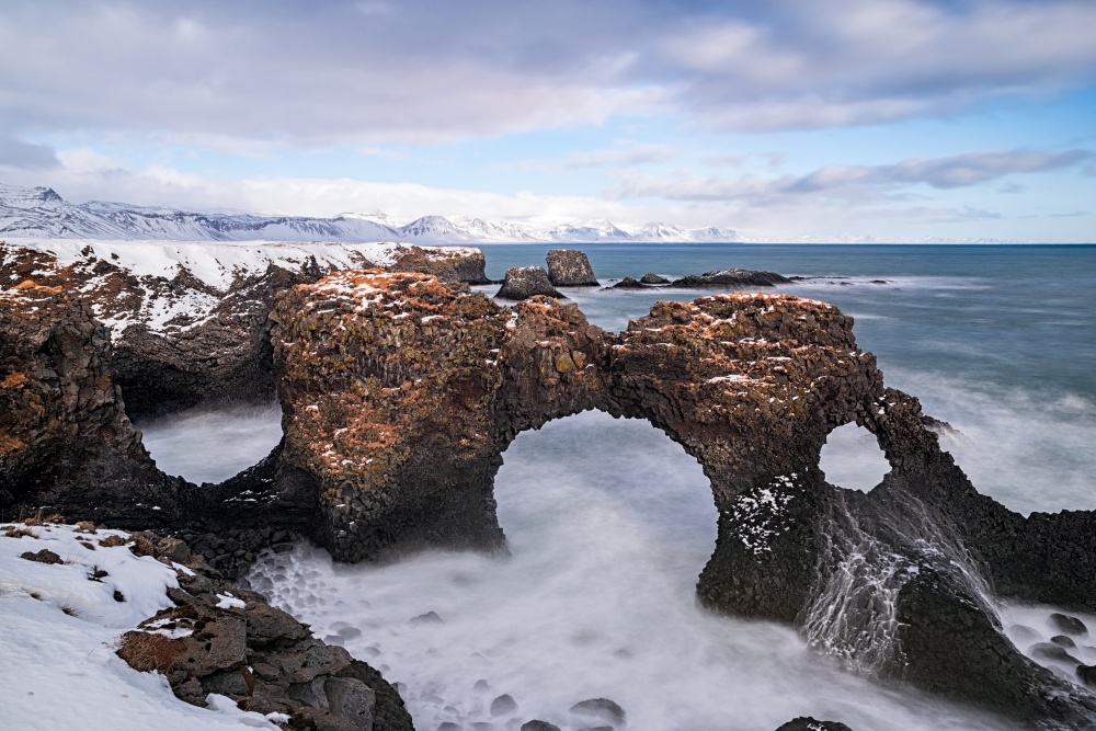 Gatklettur arch in the ocean in Arnarstapi village, Iceland. Gatklettur arch in Arnarstapi, Iceland