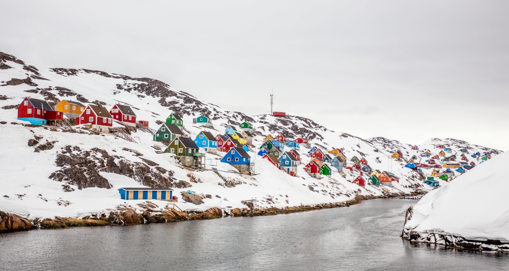 Colorful arctic village houses at the rocky fjord  in the middle of nowhere, Kangamiut, Greenland