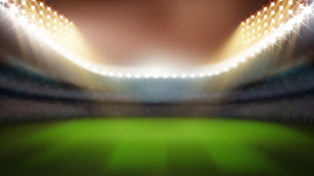 Cricket Or Rugby Stadium With Bright Lights Vector. Blurred Empty Stadium With Green Grass, Tribunes For Game Watching And Lighting Bright Lamps. Sport Field Mockup Realistic 3d Illustration. Cricket Or Rugby Stadium With Bright Lights Vector