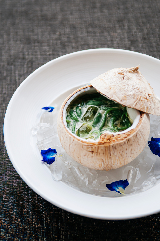 Lod Chong or Cendol, Thailand and southeast Asia country traditional refreshing cold sweet summer dessert with coconut milk served in coconut shell