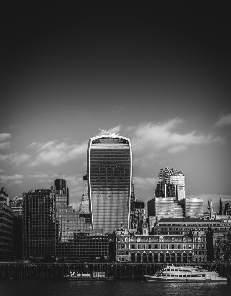 Monochrome River Thames and City of London financial district background with copy space. Monochrome River Thames and City of London financial district