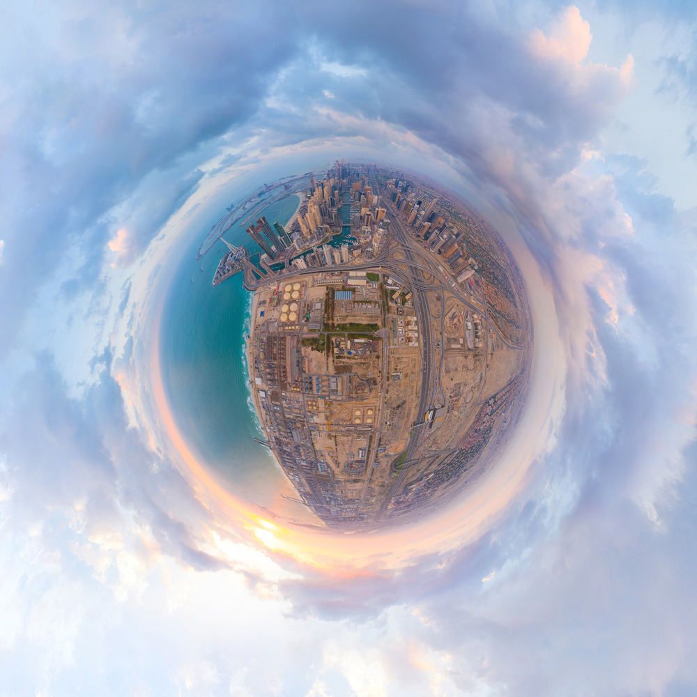 Little planet 360 degree sphere. Panorama of aerial view of Dubai Downtown skyline and highway, United Arab Emirates or UAE. Financial district in urban city. Skyscraper buildings at sunset.