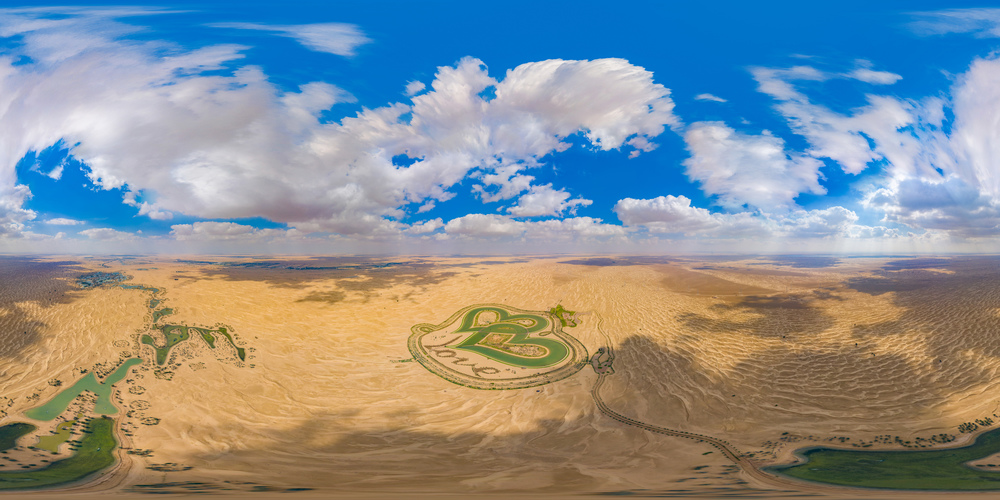 360 panorama by 180 degrees angle seamless panorama of aerial top view of love lake and sand desert, Heart shaped lakes in Al Qudra in Dubai, United Arab Emirates or UAE. A new tourist destination.