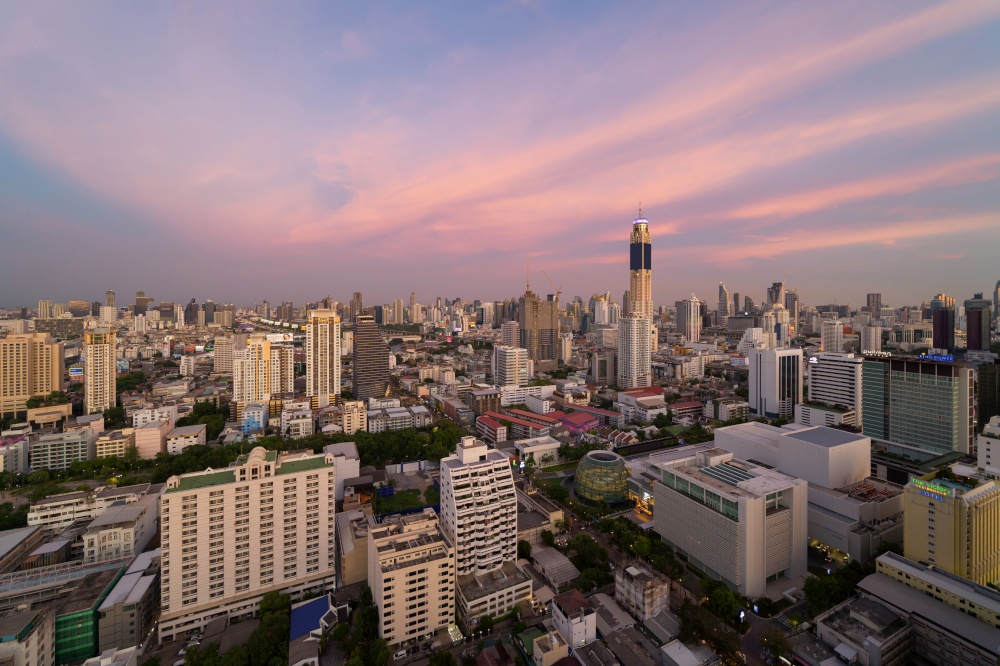 Aerial view of Bangkok Downtown Skyline. Thailand. Financial district and business centers in smart urban city in Asia. Skyscraper and high-rise buildings at sunset.