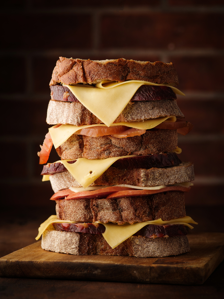 Tall sandwich with sausage and cheese