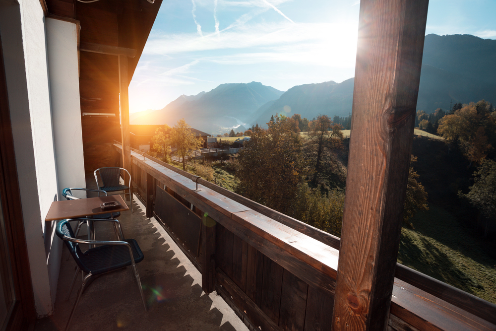 beautiful mountain view from the balcony of a wooden house. Austria