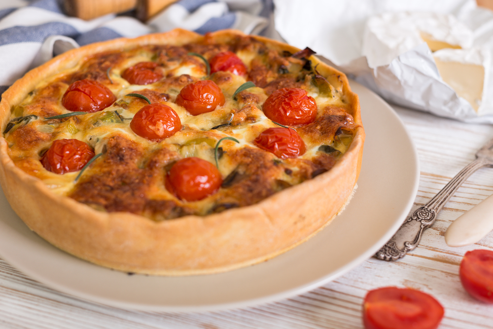 pie with  cheese brie and cherry tomatoes - french cuisine