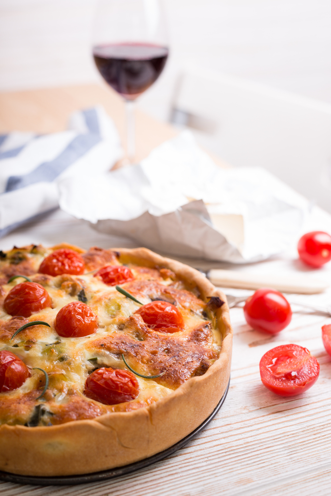 pie with  cheese brie and cherry tomatoes - french cuisine