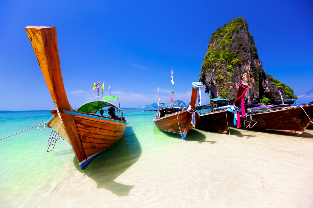 Thai longtail boat in turquoise water
