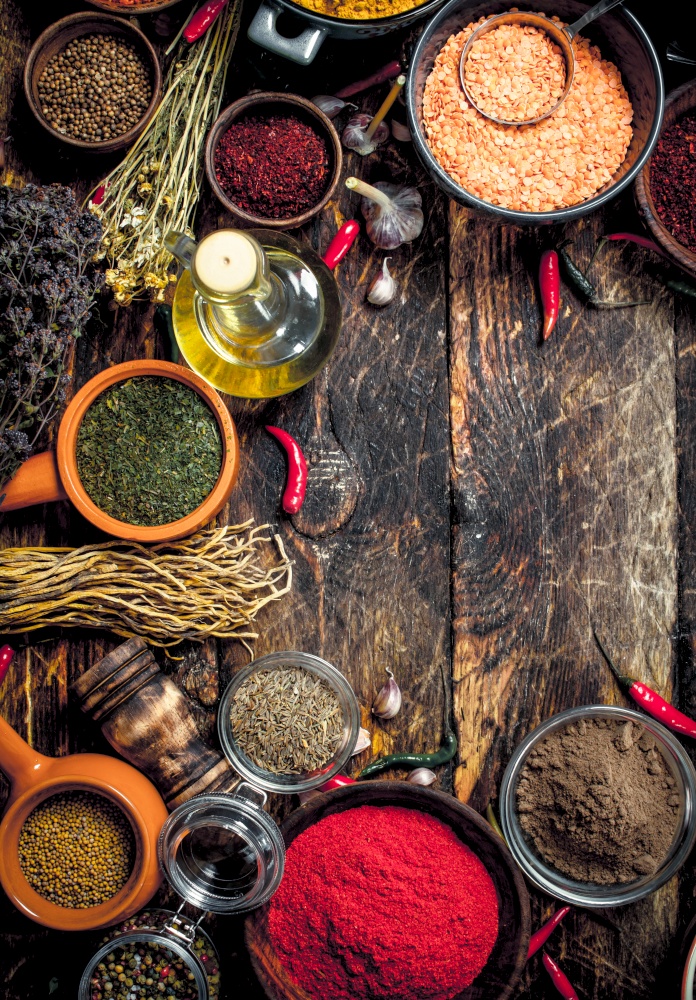 Various fragrant spices and herbs. On a wooden background.. Various fragrant spices and herbs.