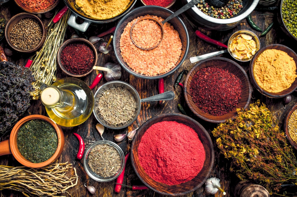 Various fragrant spices and herbs. On a wooden background.. Various fragrant spices and herbs.