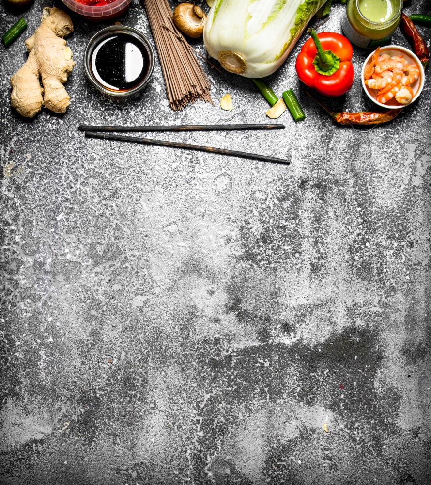 Asian food. A variety of ingredients for cooking Asian food on rustic background.