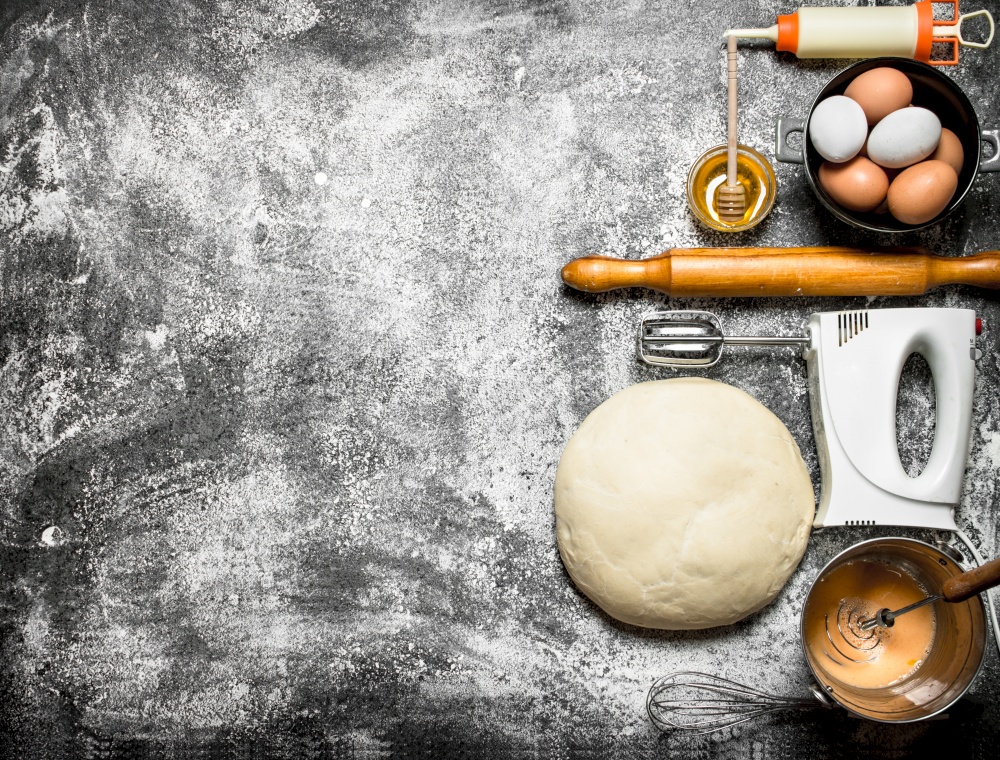 Dough background. The dough with the mixer and various ingredients .