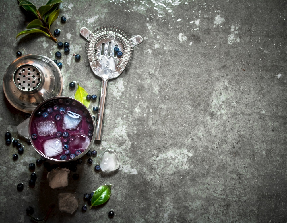Fresh blueberry shake with ice. On a stone background.. Fresh blueberry shake with ice. On stone background.