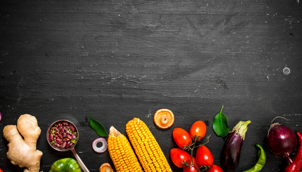 Big set organic food. Fresh raw vegetables. On a black chalkboard.. Big set organic food. Fresh raw vegetables.