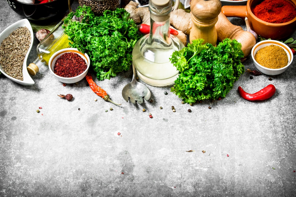 set of fresh spices and herbs. On a stone background.. set of fresh spices and herbs