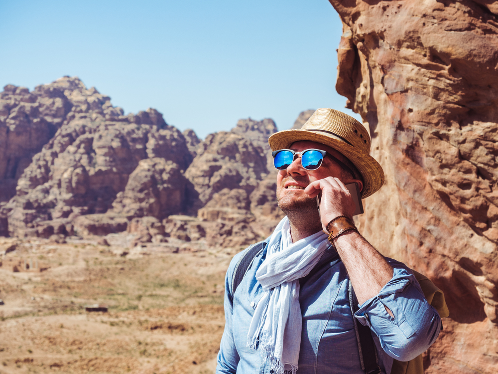 Handsome man, exploring the sights of the ancient, fabulous city of Petra in Jordan. Colorful photos. Concept of leisure, vacation and travel. Handsome man, exploring the sights of of Petra