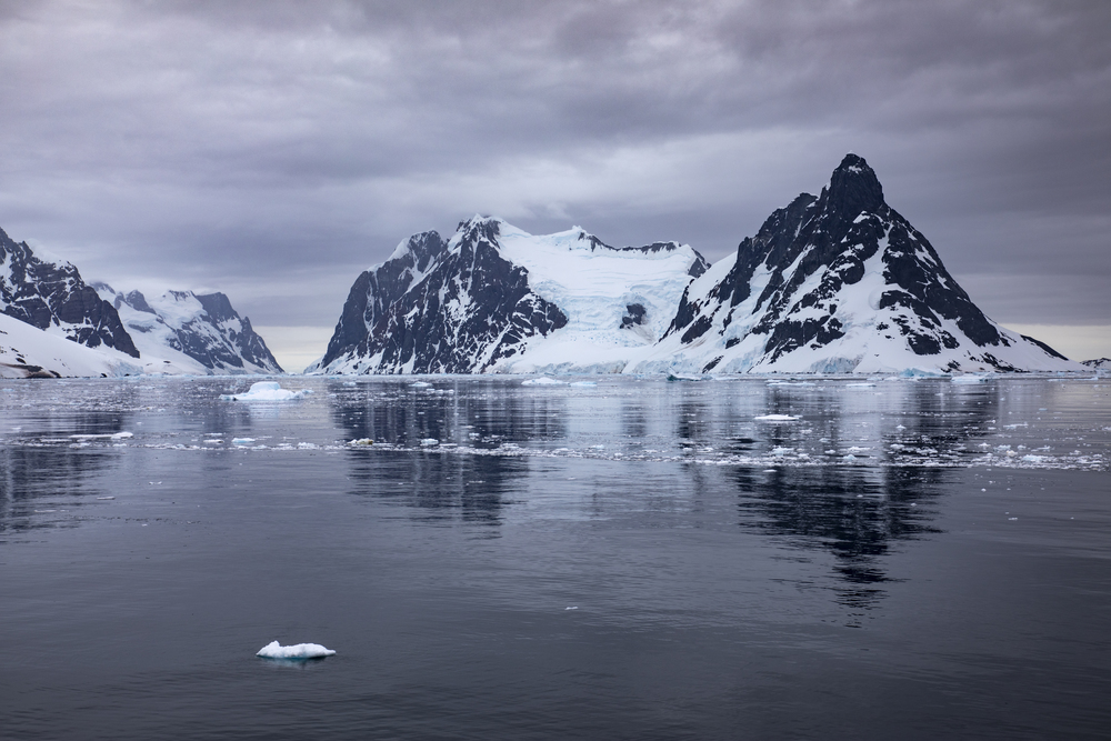 Beautiful landscape with mountains of rock, ice and snow and drift ice in the Antarctic Peninsula
