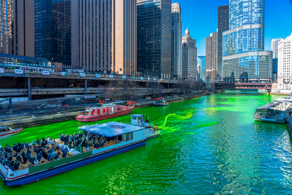 Chicago building and cityscape on Saint Patrick&quot;s day around Chicago river walk with green color dyeing river in Chicago Downtown, illinois, USA, crowned irish and american people are celebrating.