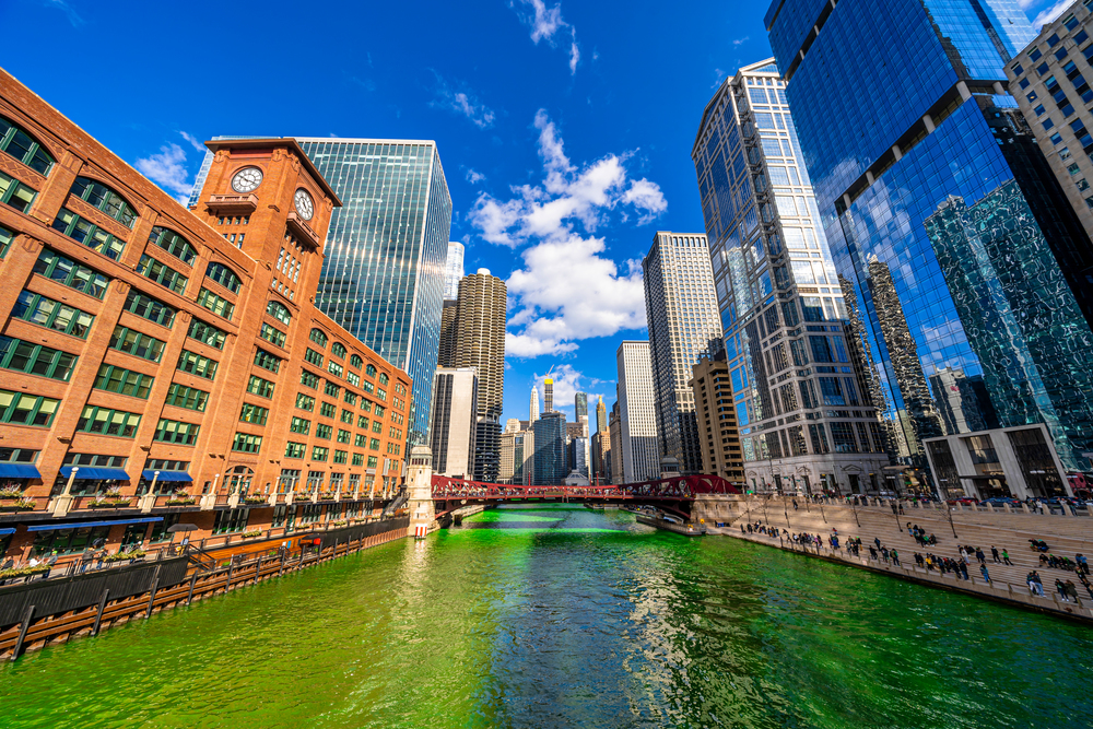 Chicago building and cityscape on Saint Patrick&quot;s day around Chicago river walk with green color dyeing river in Chicago Downtown, illinois, USA, crowned irish and american people are celebrating.