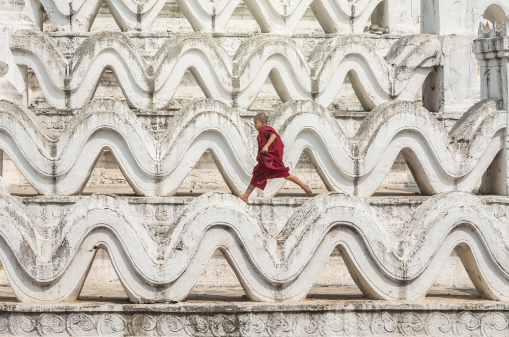The young monk are running and jumping on the Mya Thein Tan Pagoda at bagan, mandalay, myanmar