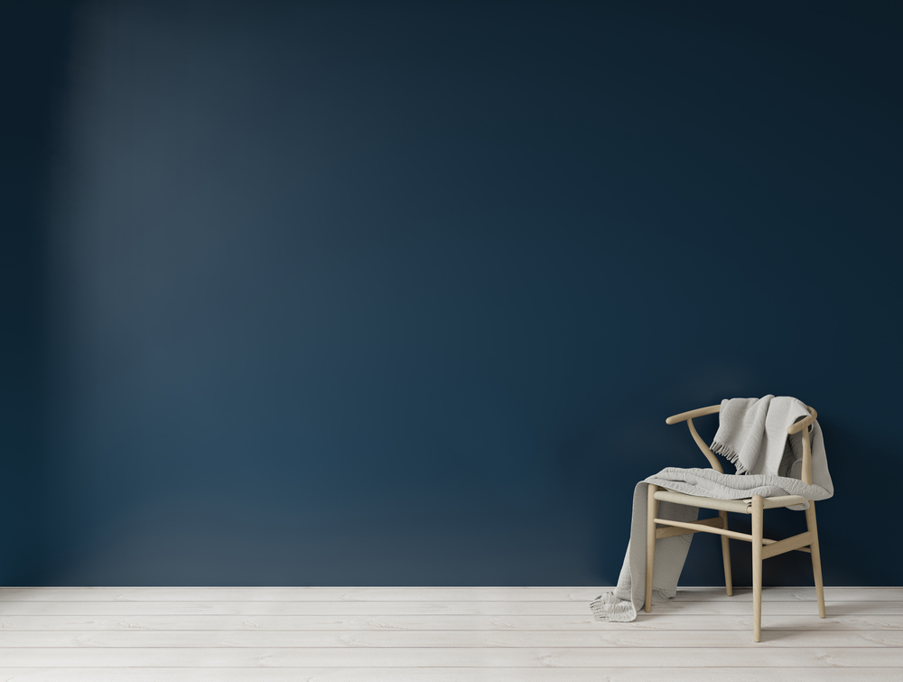 Interior with dark blue green wall wooden chair and empty wall for copy space ,3d rendering