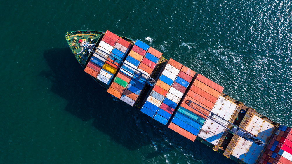 Aerial view container ship carrying container box global business cargo freight shipping commercial trade logistic and transportation oversea worldwide  by container vessel.Container cargo freight ship.