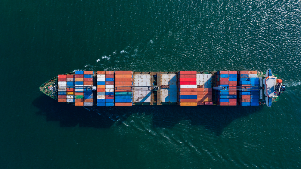Aerial view container ship carrying container box global business cargo freight shipping commercial trade logistic and transportation oversea worldwide  by container vessel.Container cargo freight ship.