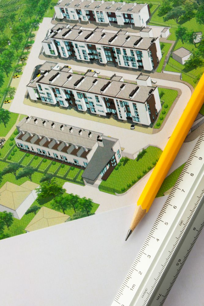 Pencil and ruler on architectural design of townhouses