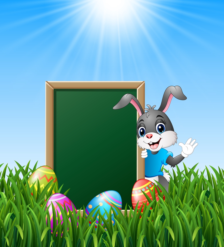 Cartoon bunny waving hand with easter eggs and green chalkboard in the grass